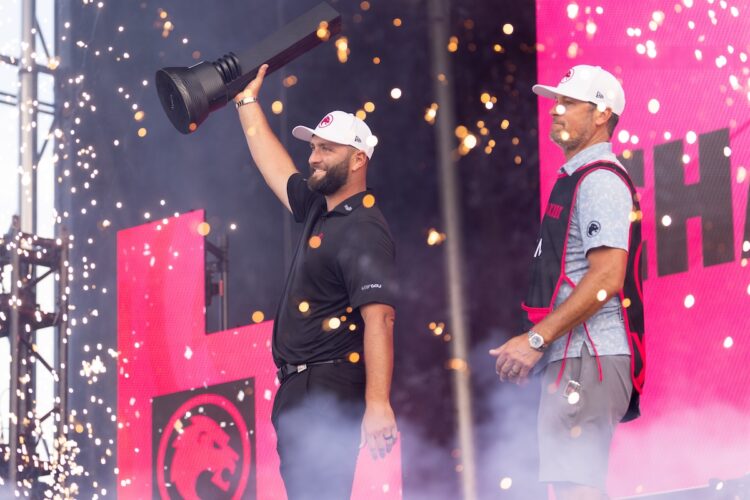 2024 Individual Champion, Captain Jon Rahm of Legion XIII and caddie, Adam Hayes, seen on stage during the trophy ceremoy after the final round of LIV Golf Chicago at Bolingbrook Golf Club on Sunday, September 15, 2024 in Bolingbrook, Illinois. (Photo by Chris Trotman/LIV Golf)